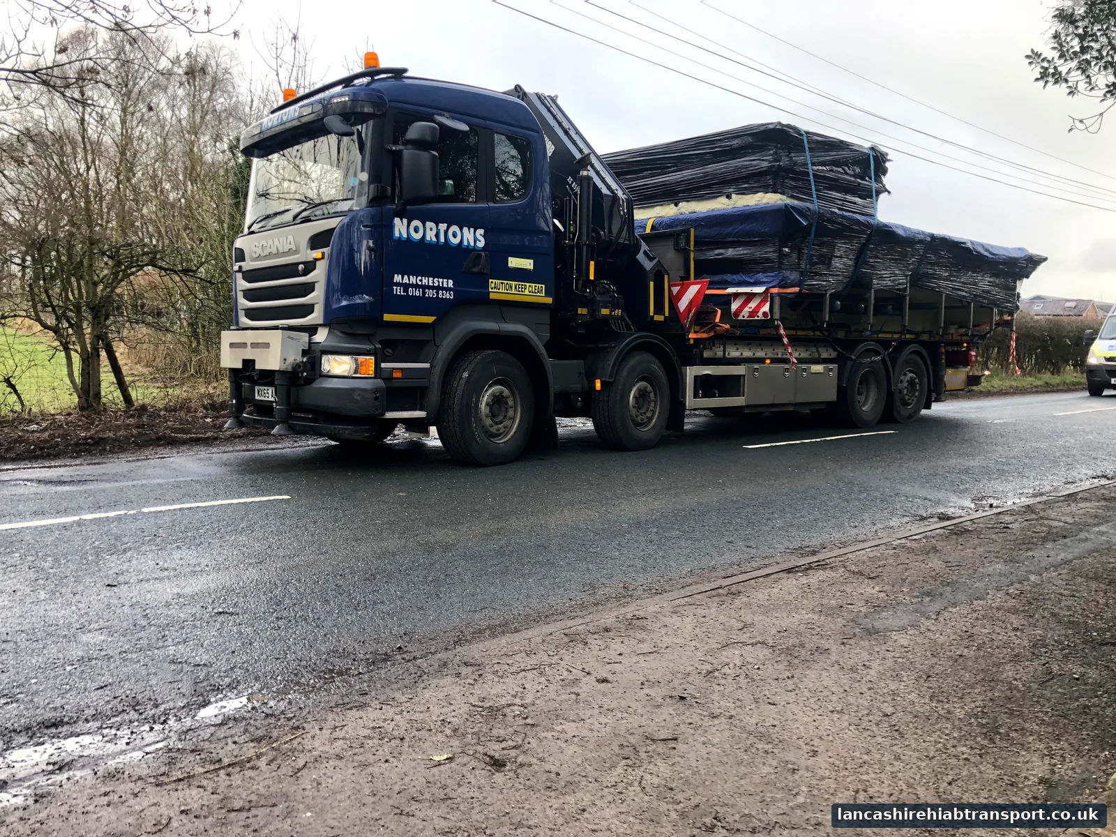 Large Hiab lorry delivering a medical pool in Wigan