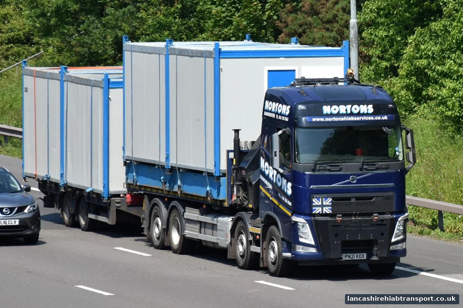 Portable cabins transported by Hiab lorry for work serving Burnley
