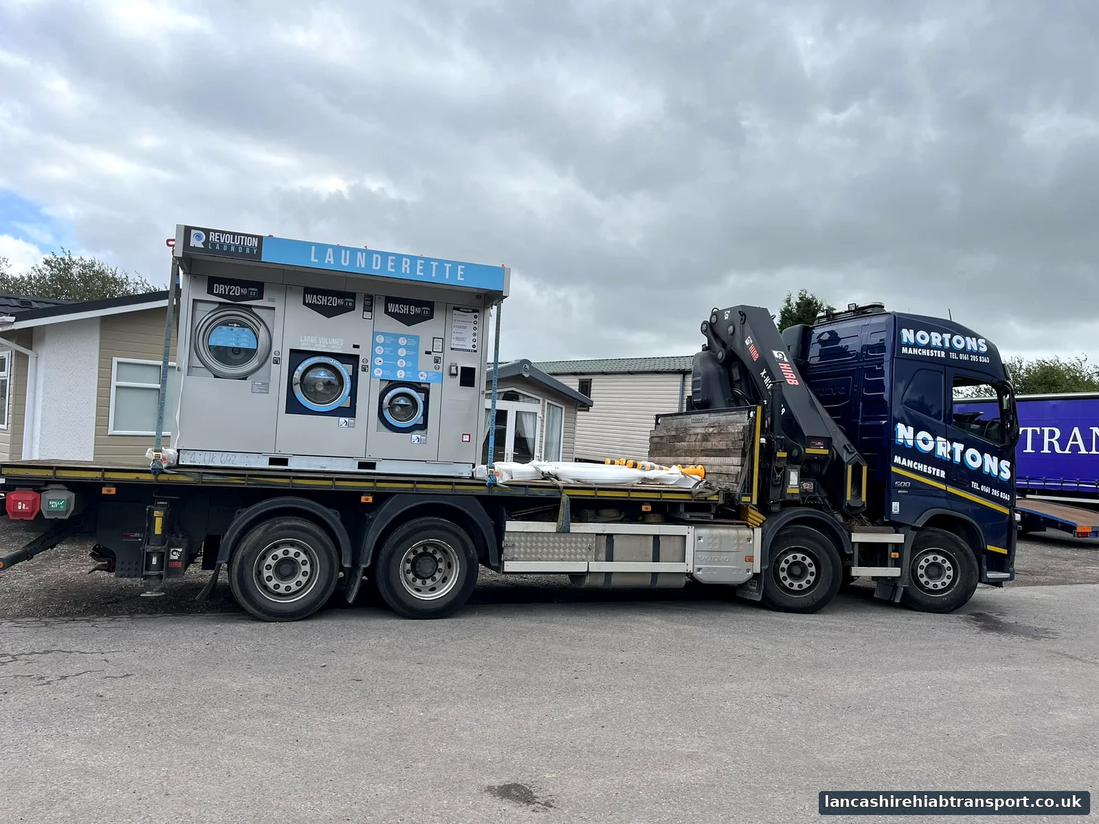 Hiab crane lorry transporting a portable unit for work serving Fleetwood