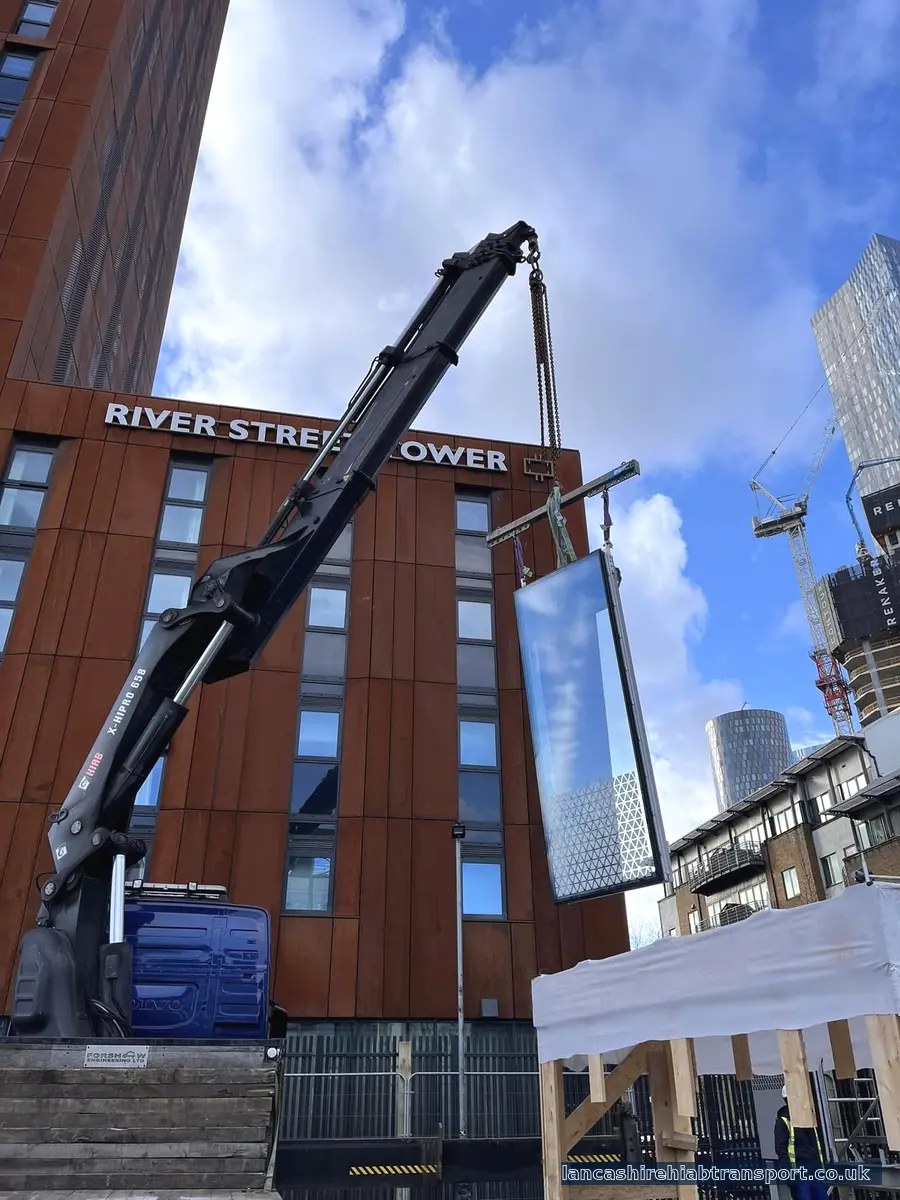 Long-reach Hiab crane lifting in Manchester