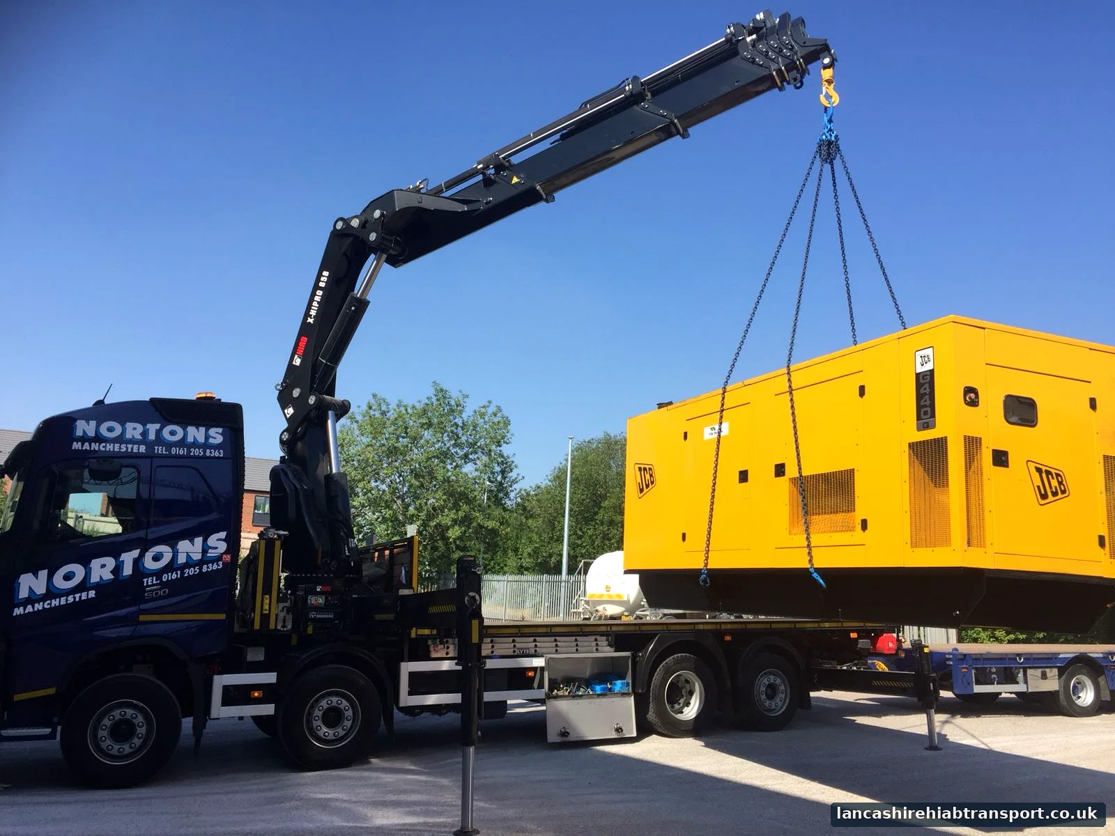 Hiab lorry lifting and transporting large plant equipment
