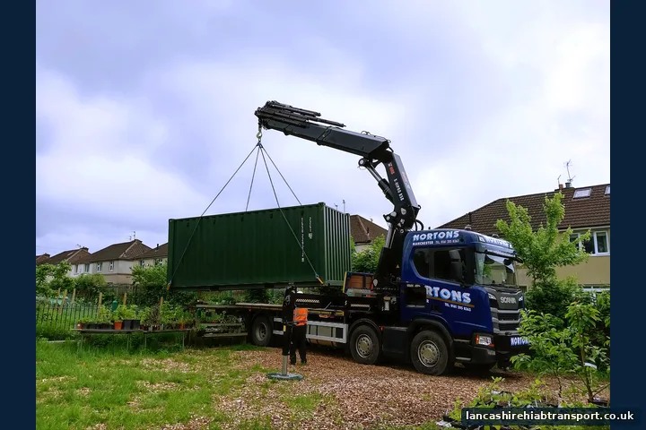 Hiab lorry lifting a shipping container